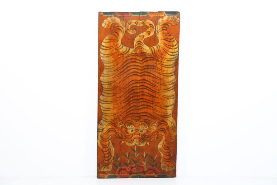 A wooden lacquered panel painted with tiger skin
Tibet, early 20th century  (Arte Himalayana )
