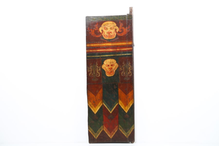 A wooden lacquered door painted with two skulls 
Tibet, 19th century  (Arte Himalayana )