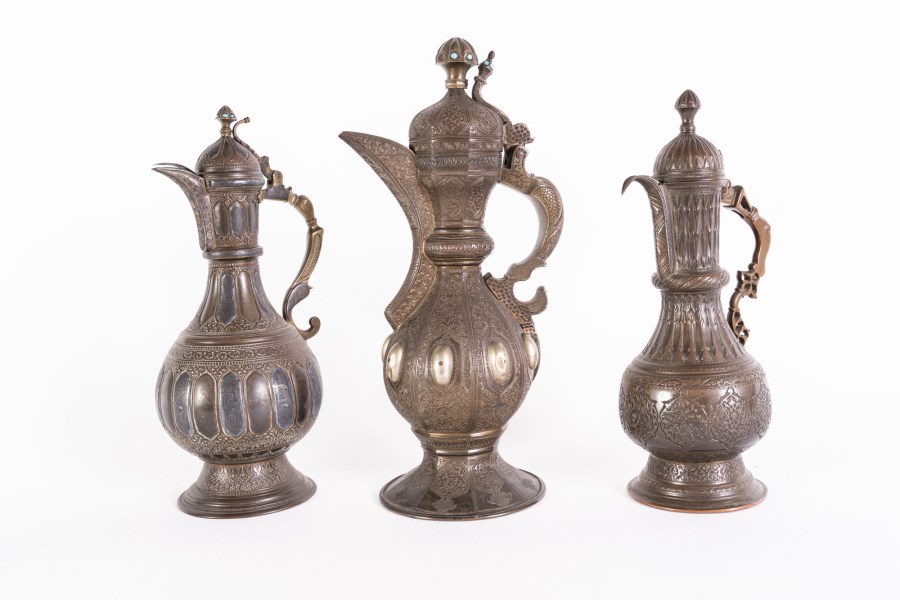 Three metal coffee jugs engraved with arabesques and vegetal motifs 
Persia/Afghanistan, 19th century  (Arte Islamica )