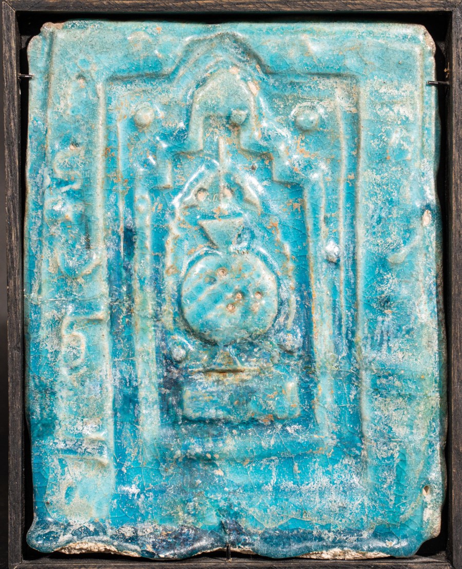A turquoise glazed Kashan moulded mihrab tile 
Iran, 12th - 13th century  (Arte Islamica )