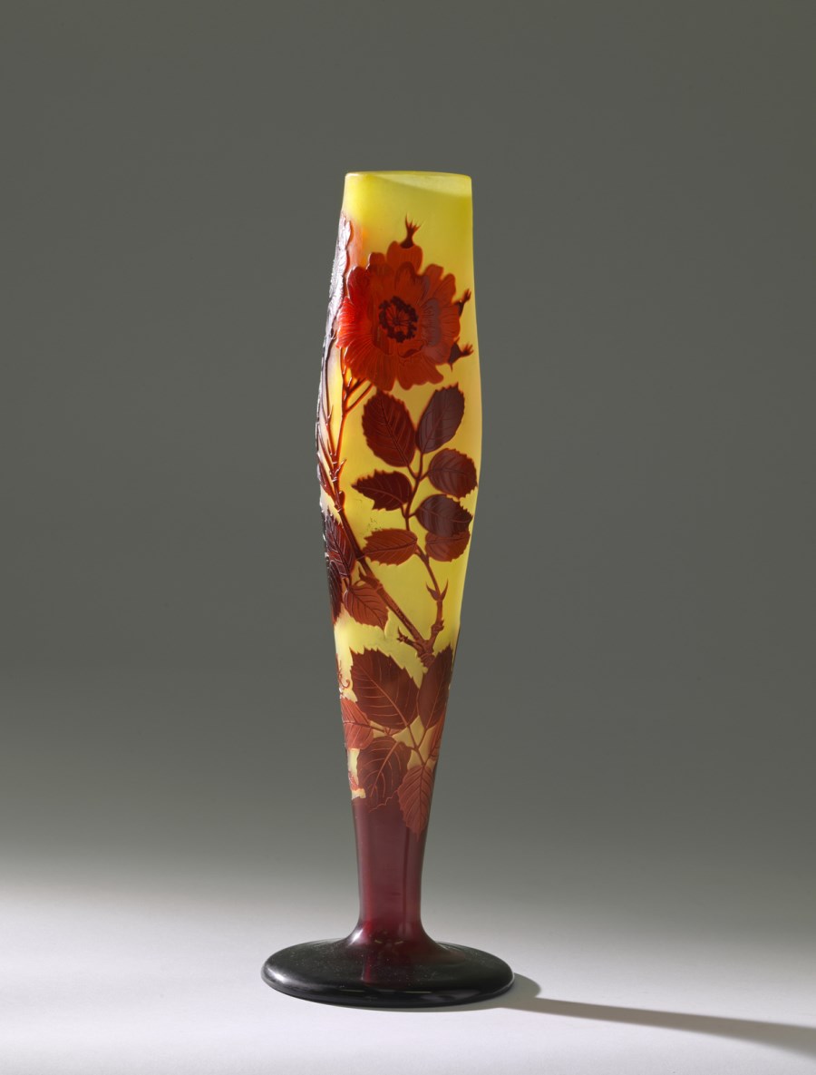 Important double-resting glass balustrade vase on a circular base, decorated with branches of roses and leaves, finely etched with acid in the shades of ruby red on a honey-coloured background. (Emile Gallé)