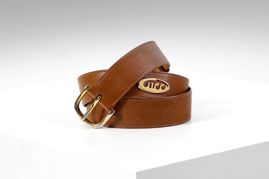 Tan leather belt with gold buckle.  (Gucci )