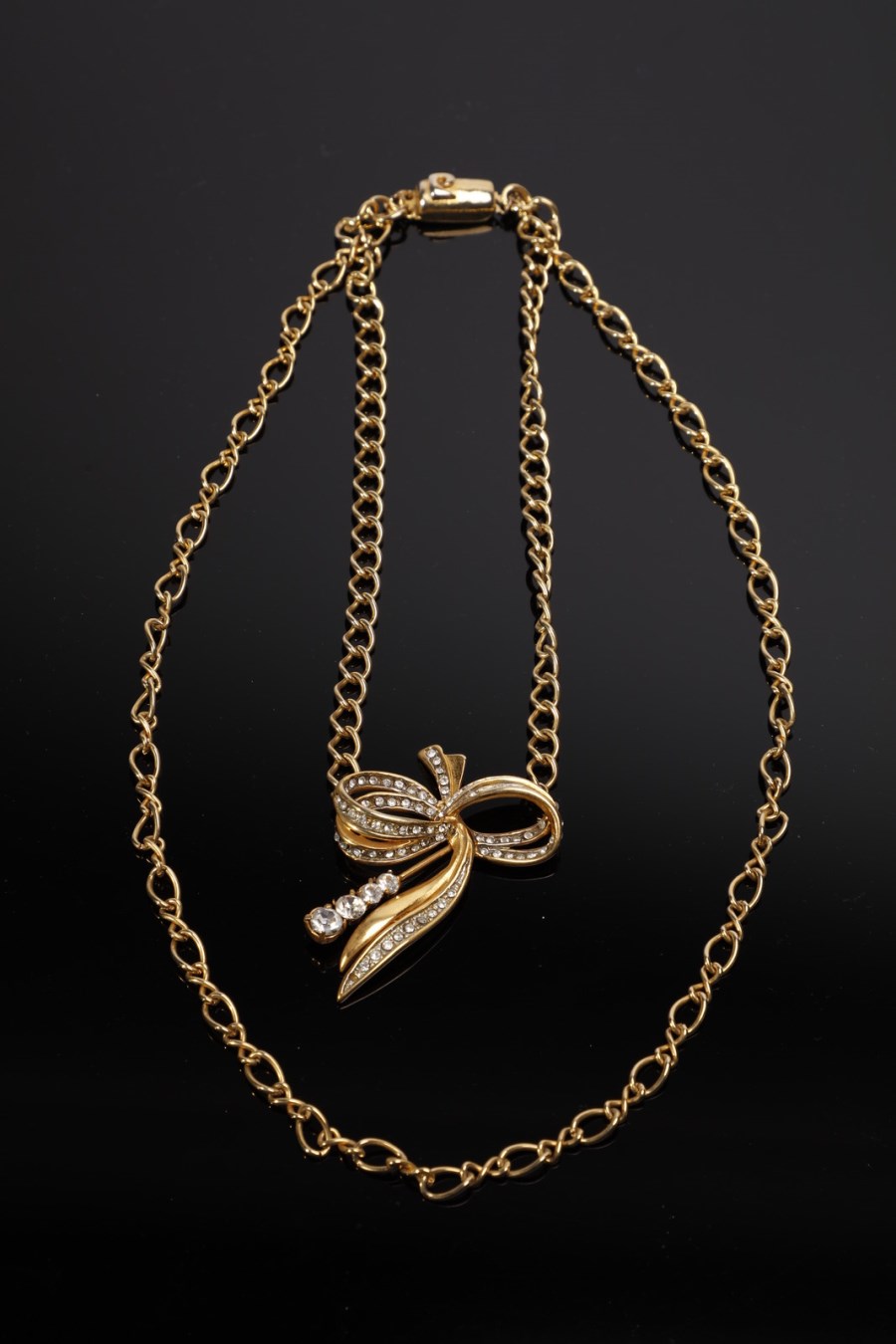 Double strand necklace, golden chain and rhinestone bow (Pierre  Cardin)