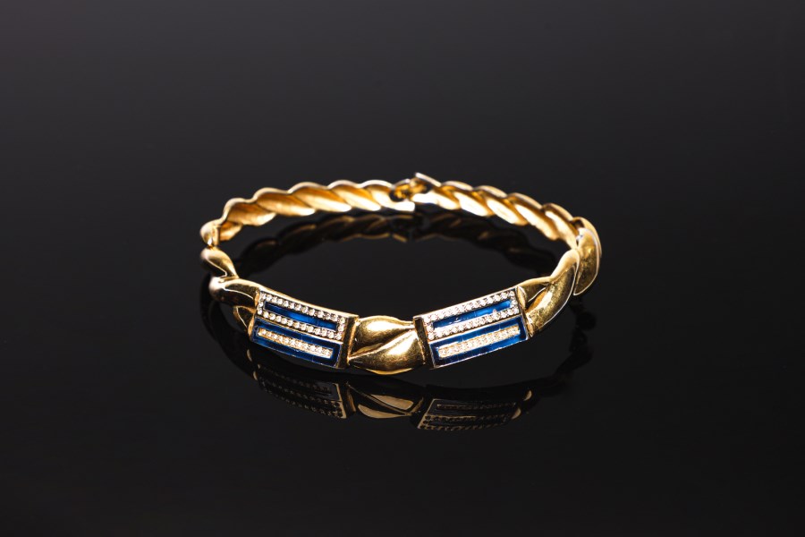 Golden torque- style rigid necklace with rhinestones. (Pierre  Cardin)