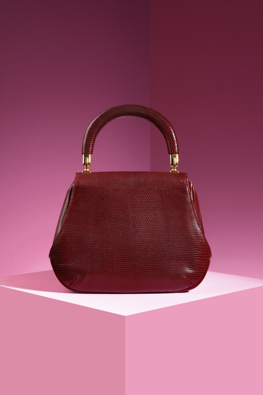 Sold at Auction: Gucci Embossed Oxblood Leather Purse