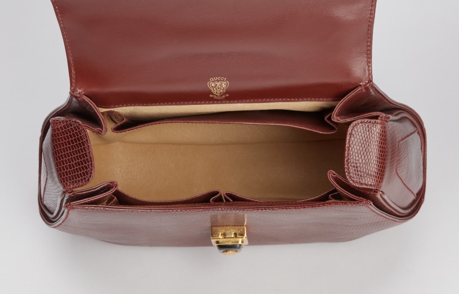 Sold at Auction: Gucci Embossed Oxblood Leather Purse