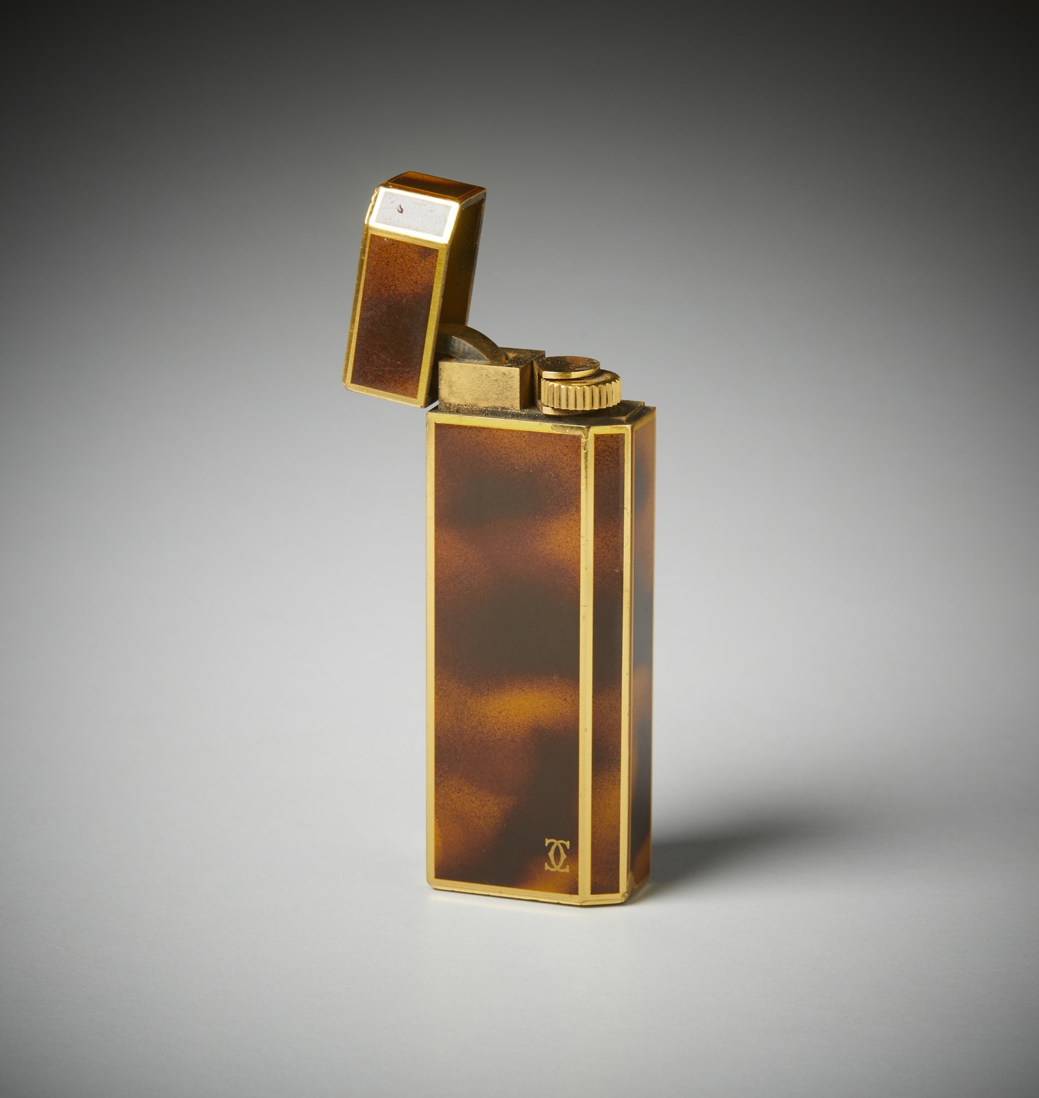 Cartier lighter 5 faces small in gold and lacquer with original case.  ( Cartier)