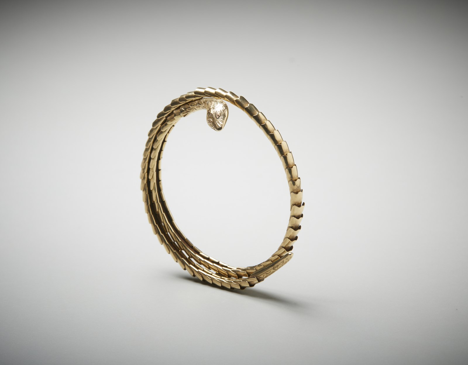 9k gold snake slave bracelet. (. )