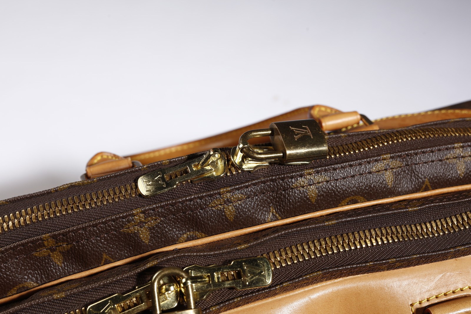 Sold at Auction: Louis Vuitton - a vintage Monogram zipped travel