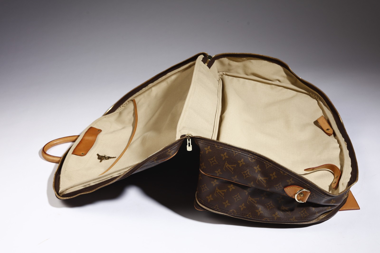 Sold at Auction: Louis Vuitton Evasion Monogram Travel Bag
