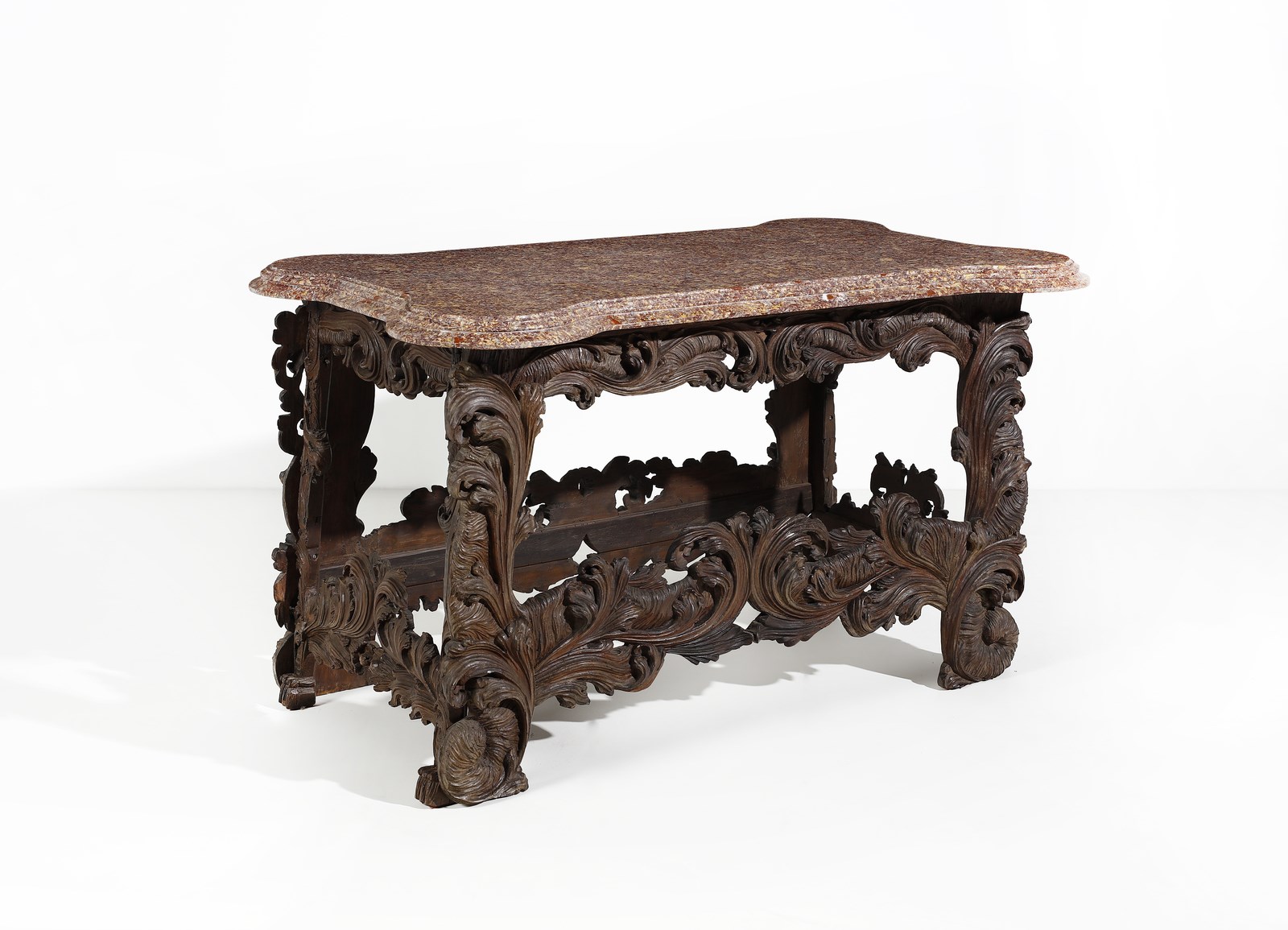 Tavolo in legno intagliato in forma di volute e motivi fitomorfi, piano in marmo broccatello di Spagna ( Manifattura Italiana Del XVII-XVIII Secolo)