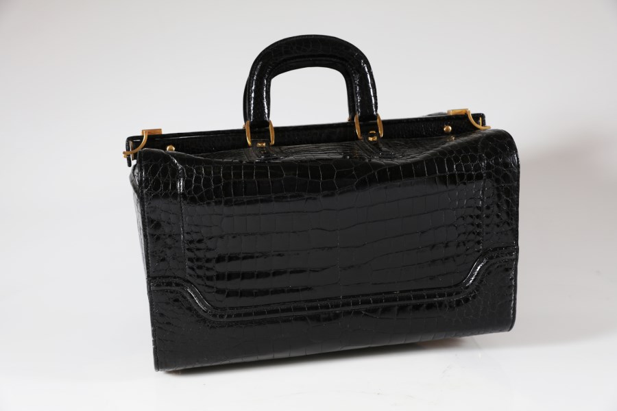 Travel bag in baby crocodile leather. (Gucci )
